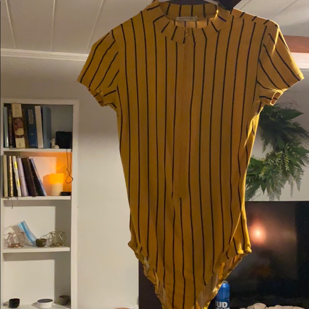 Black and yellow body suit